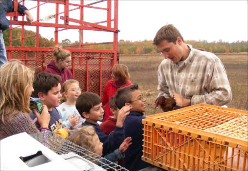 Chuck Roohr shows off his chickens.